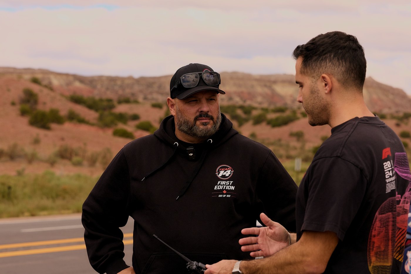 A Team 14 driver talks through the route on a desert roadside